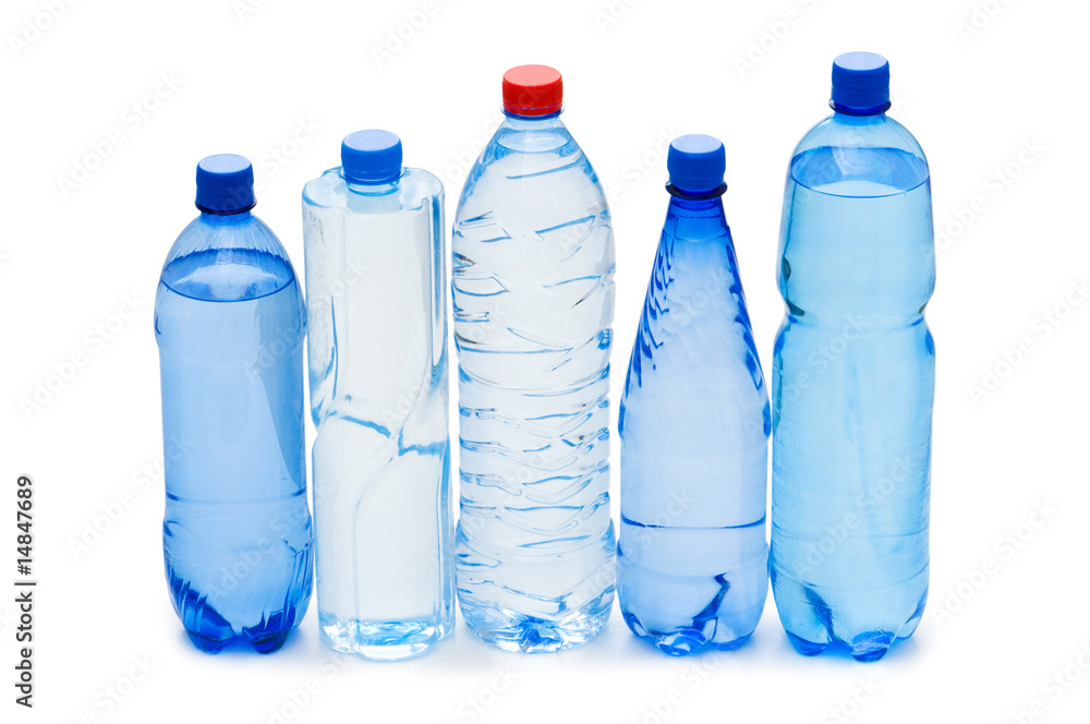 Bottles of water isolated on the white Bottles of water isolated on the white