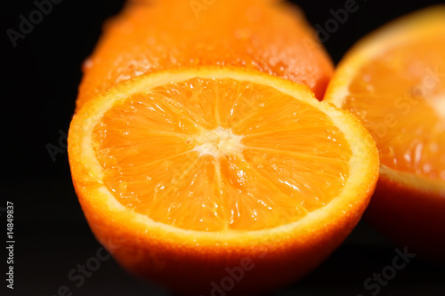 Sliced orange on black background
