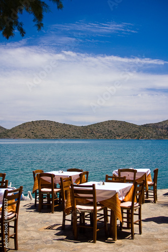 Empty restaurant on a coast © Tim