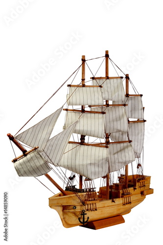 Model of ship with sails on a white background