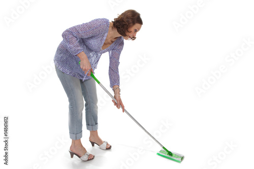 woman washes up the floor by a swab