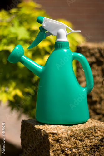green watering pot