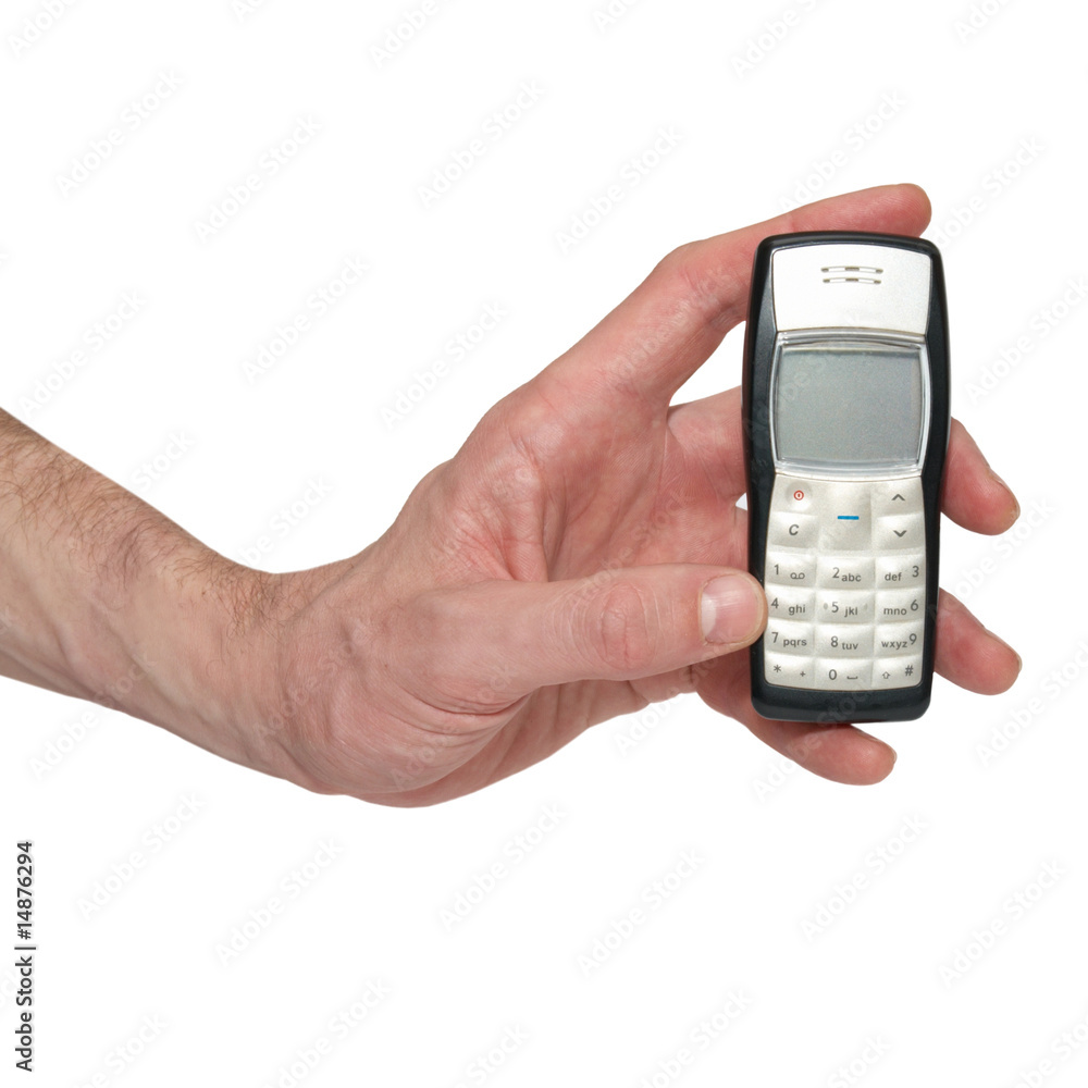 Silver mobile phone in a hand Silver mobile phone in a hand