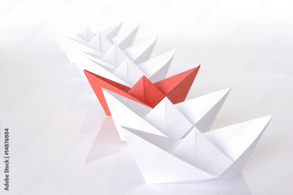 Red paper boat in the line Red paper boat in the line