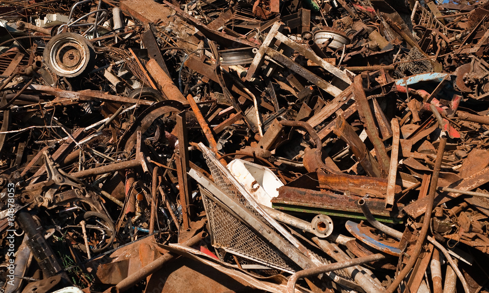 Rusted discarded pieces of metal in junkyard Rusted discarded pieces of metal in junkyard
