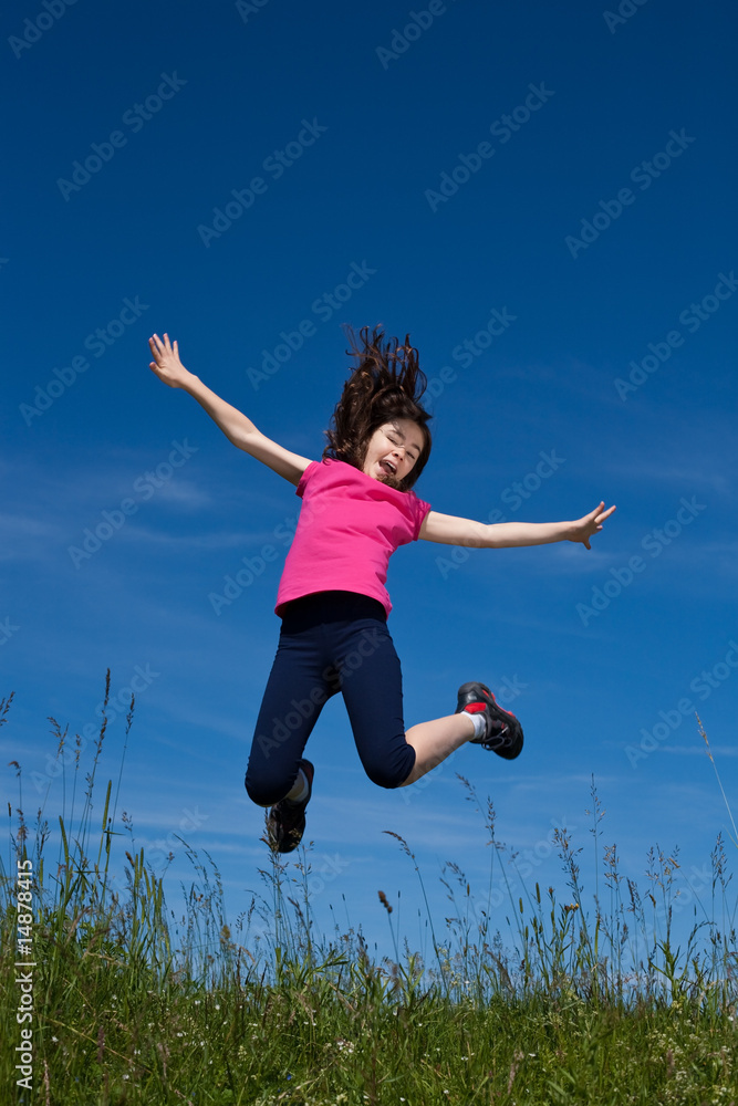 Girl jumping, running against blue sky Girl jumping, running against blue sky