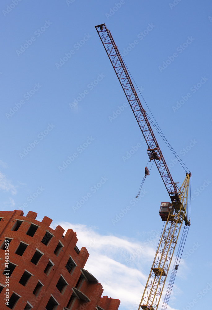 Tower crane against a background of the sky Tower crane against a background of the sky