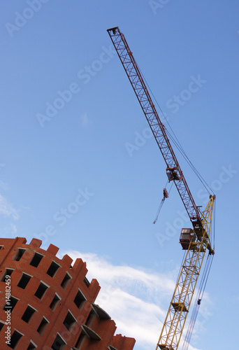 Tower crane against a background of the sky