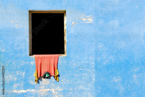 Photography blue wall with shirt hanging to dry in baracoa, cuba