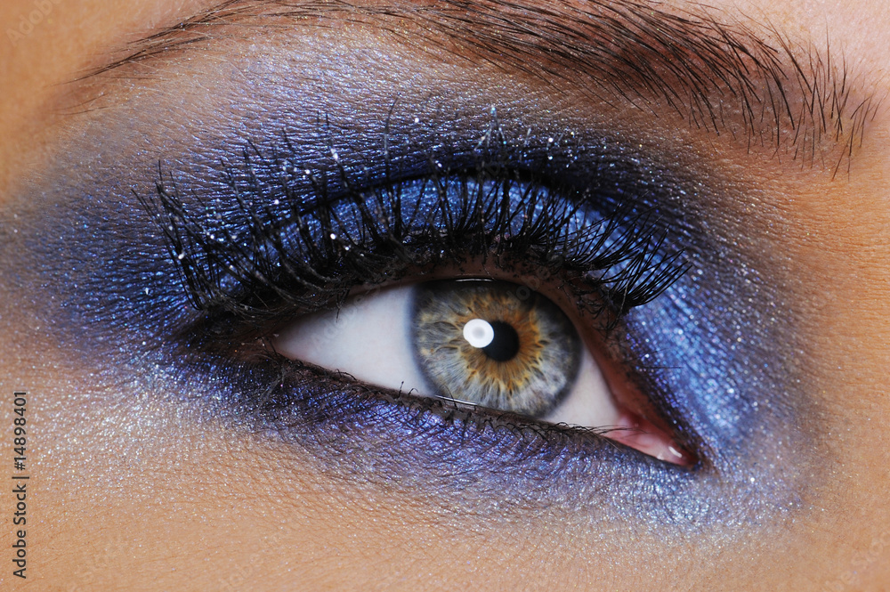 eye with bright blue eyeshadow - obrazy, fototapety, plakaty 