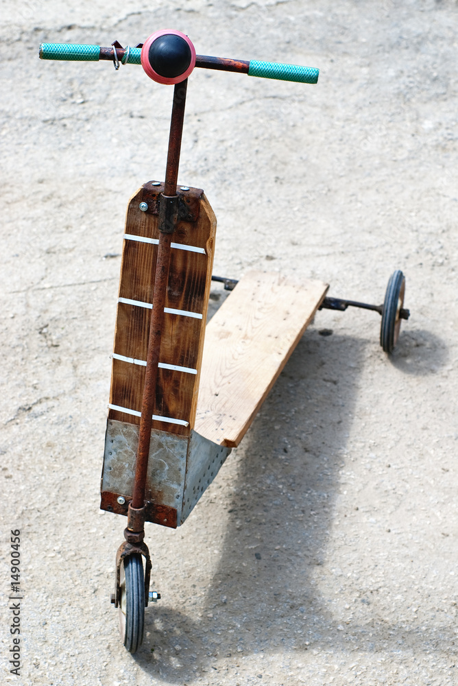 Self-made push stand up scooter from wood for kids