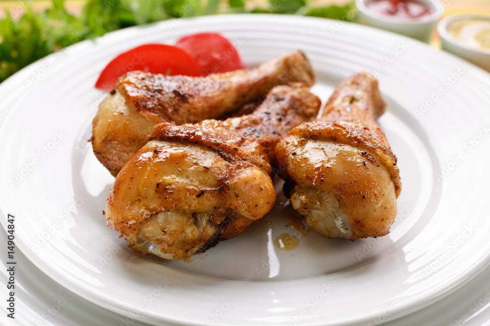 Roasted chicken legs with chips and vegetables Roasted chicken legs with chips and vegetables