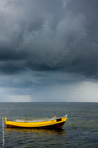Fishing boat and stormy sky
