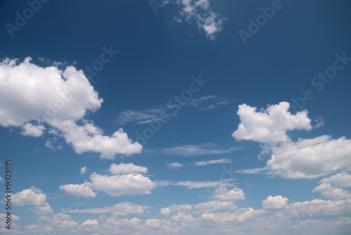 Soft white clouds against blue sky © soleg