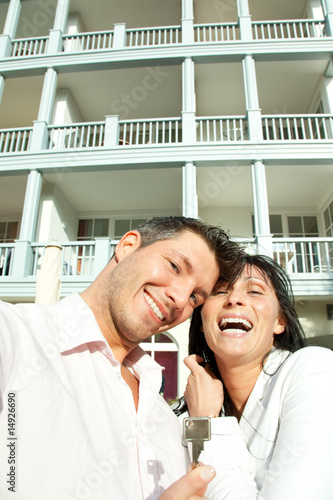 happy real estate couple with key photo