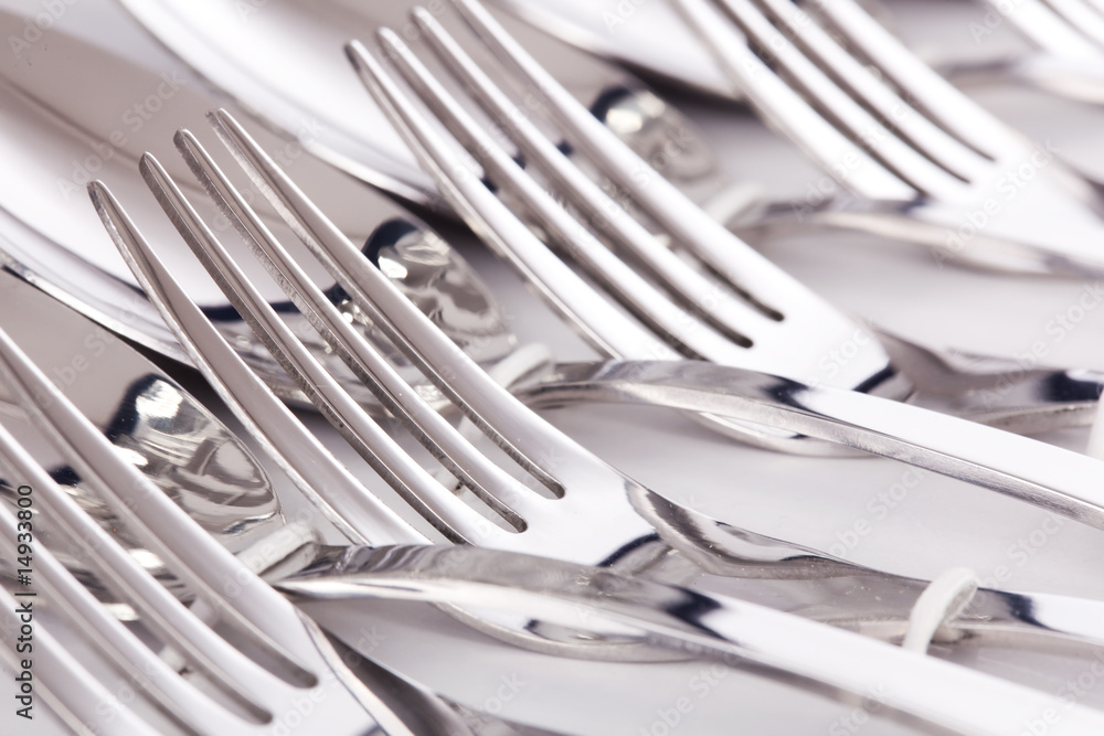 Close up of flatware forks isolated on white background Close up of flatware forks isolated on white background