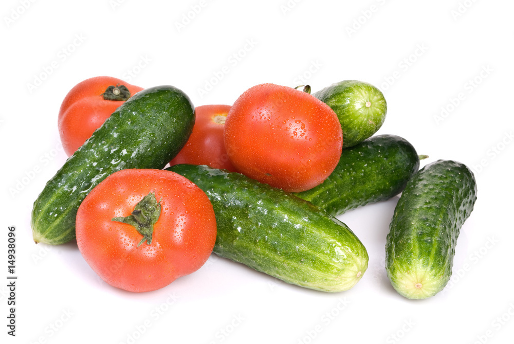 Cucumbers and tomato, isolated on white background