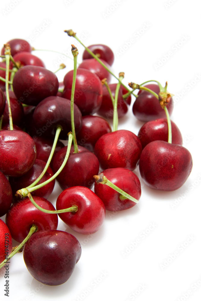 red cherries in closeup isolated on white background