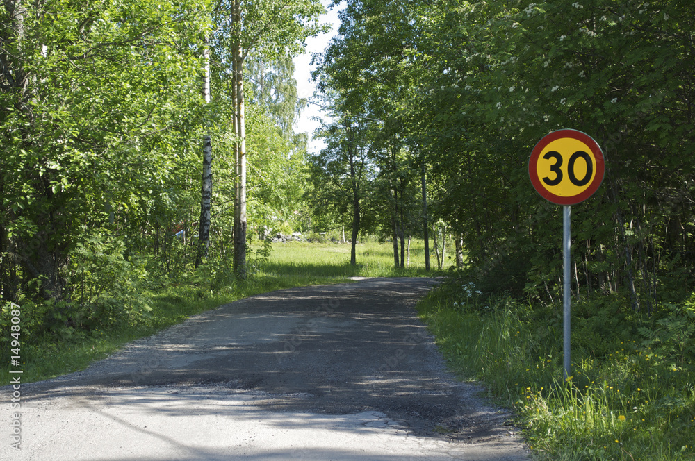 Country road with a sign