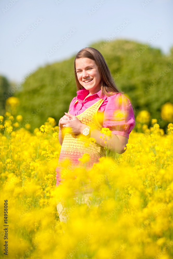Pretty smiling girl relaxing on green meadow full of flowers. So Pretty smiling girl relaxing on green meadow full of flowers. So