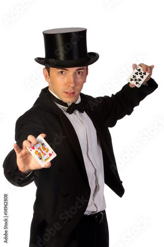 young magician performing with cards