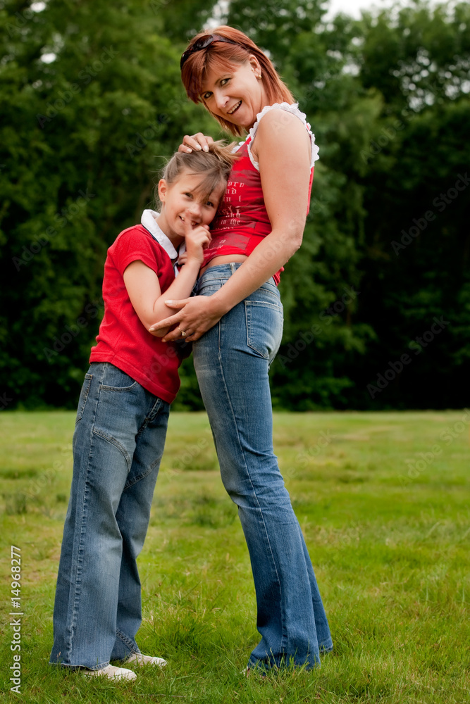 Happy mother and daugther in red Happy mother and daugther in red
