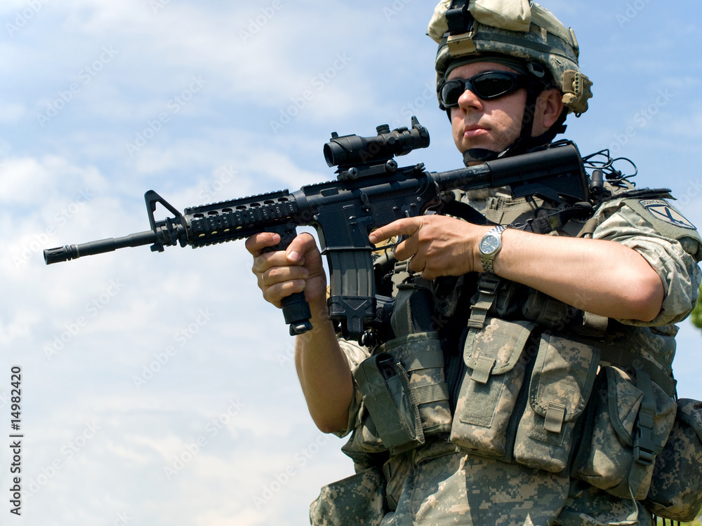 Soldier aiming his rifle Soldier aiming his rifle