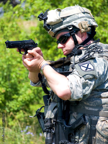 Soldier aiming his gun