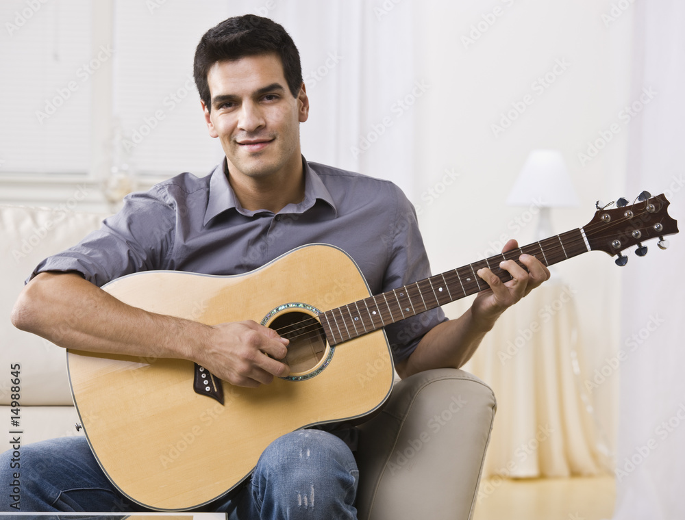 Obraz premium Relaxed Man Playing Guitar
