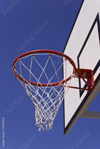 basketball hoop against blue sky