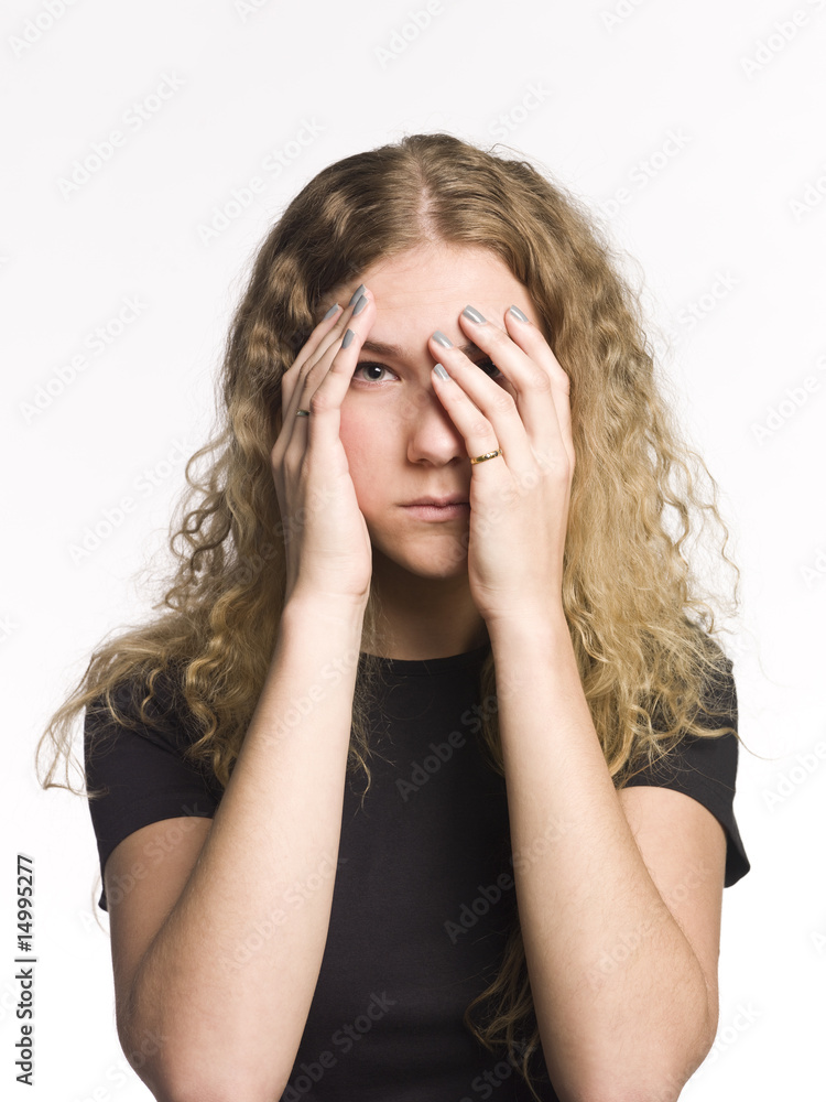 Portrait of a serious woman playing peek-a-boo Portrait of a serious woman playing peek-a-boo