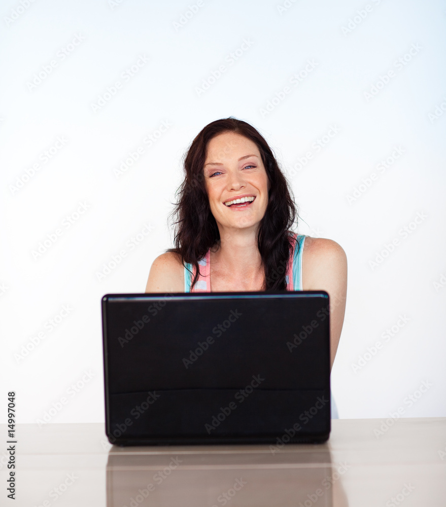 Portrait of a smiling woman with her laptop Portrait of a smiling woman with her laptop