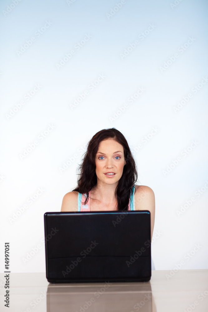 Woman concentrated on her laptop with copy-space Woman concentrated on her laptop with copy-space