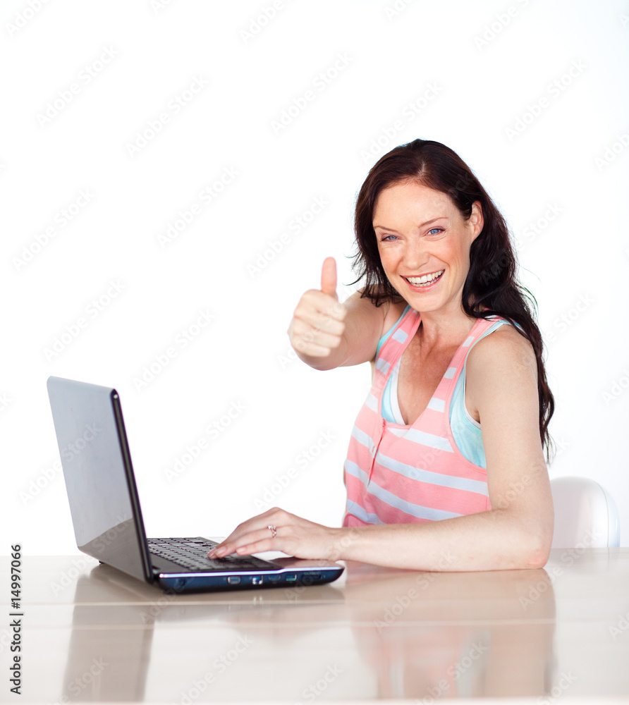 Happy woman having fun with laptop and thumb up Happy woman having fun with laptop and thumb up