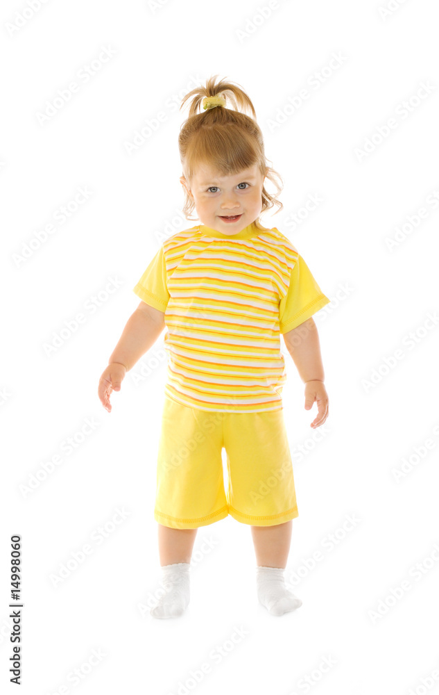 Small smiling girl in yellow pants and shirt Small smiling girl in yellow pants and shirt