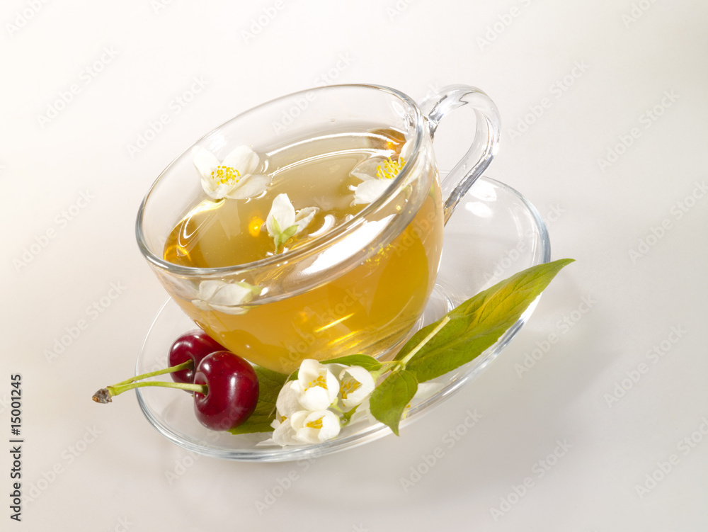 breakfast still-life. green tea with cherry and fresh jasmine breakfast still-life. green tea with cherry and fresh jasmine