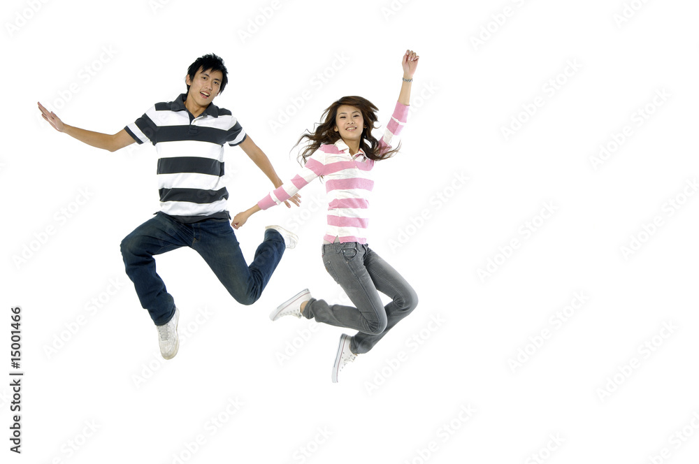 happy casual couple jumping of joy