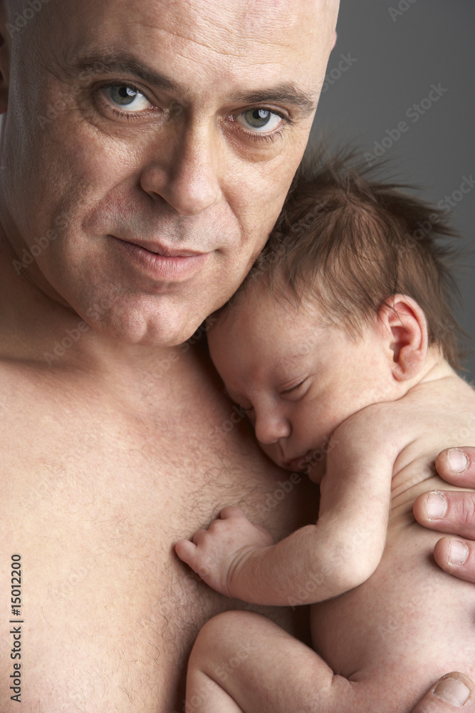 Father Hugging Newborn Baby Father Hugging Newborn Baby