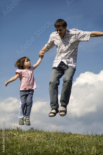 fun of father and child - jump and sky