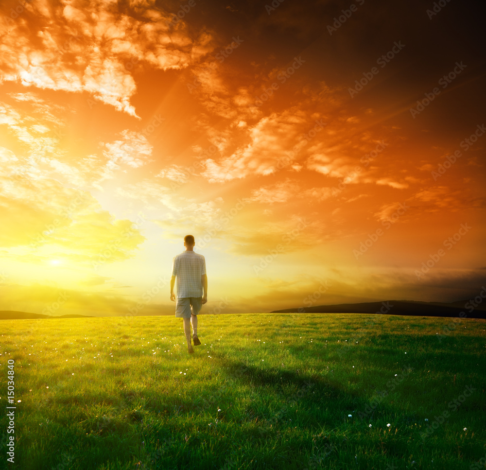 one man and field of spring grass one man and field of spring grass
