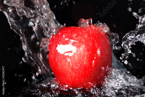 fresh red apple in water splash