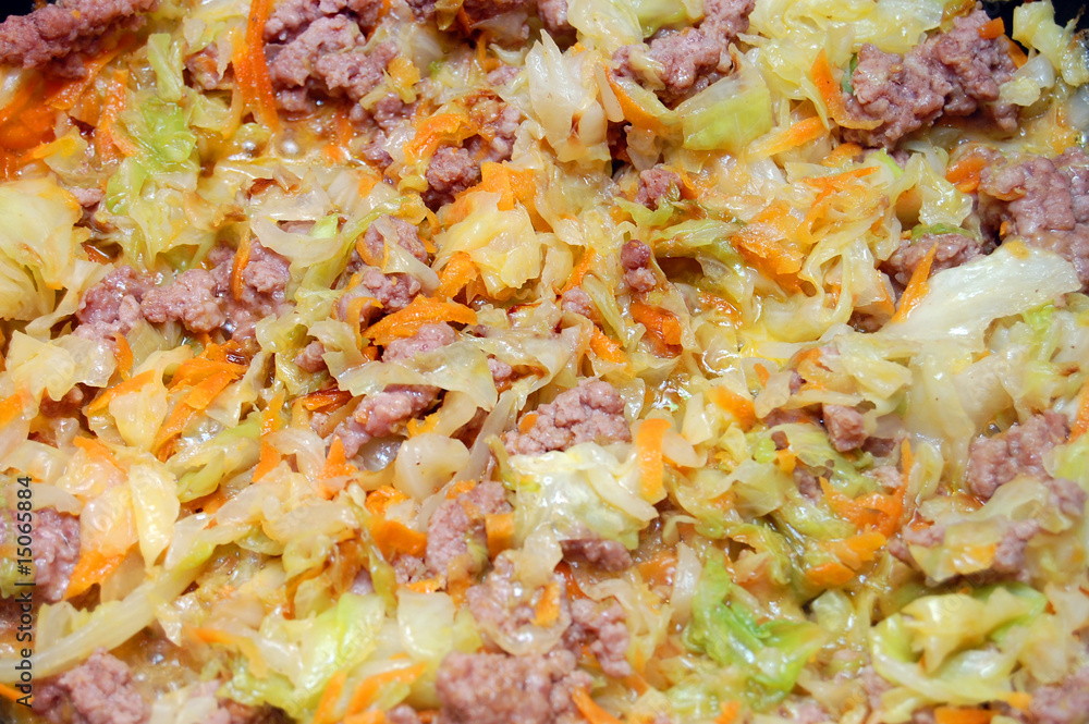 Background from stewed cabbage with meat and carrots Background from stewed cabbage with meat and carrots