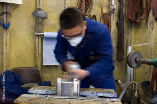 Polishing metal in workshop