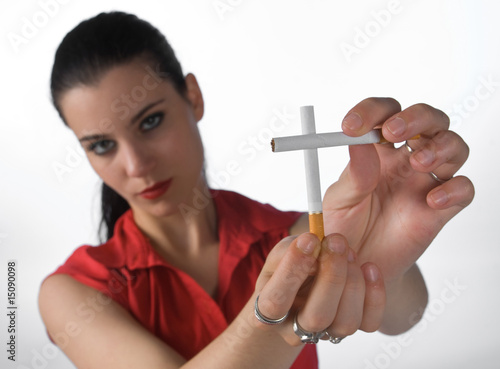 woman making cross sign with cigarettes