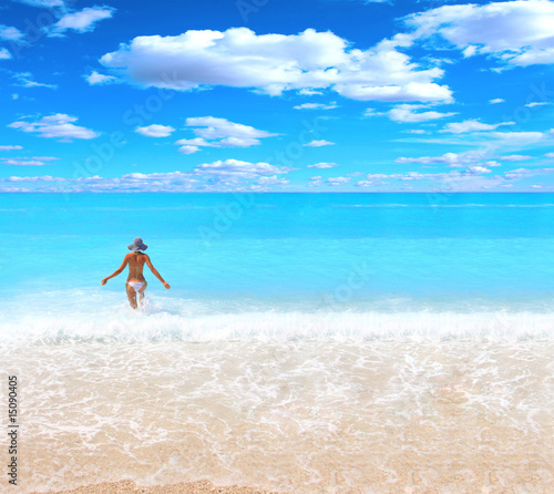 Photography Young beautiful sexy tanned blond woman in the sea