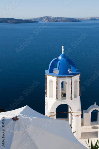 classic blue dome orthodox church over harbor santorini greece