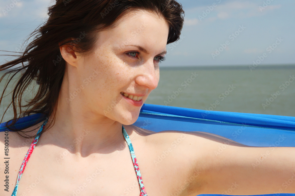 Beautiful young girl on a background a sea Beautiful young girl on a background a sea