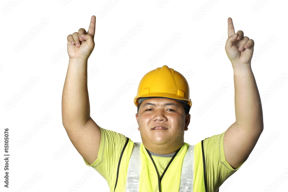 Asian construction worker pointing up with white copy space Asian construction worker pointing up with white copy space