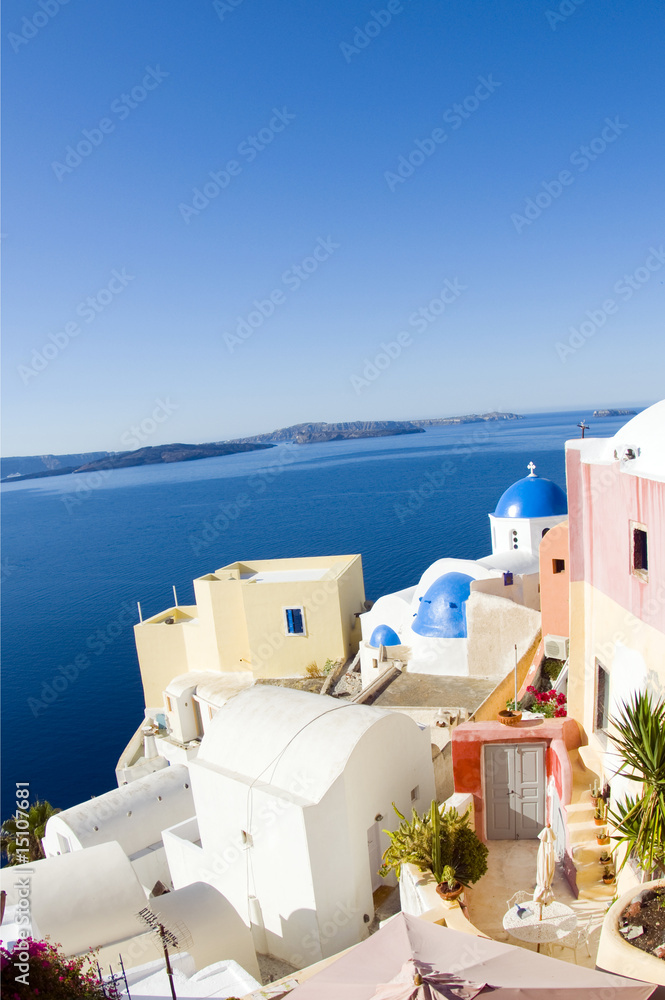 street scene with blue dome church and cyclades architecture san