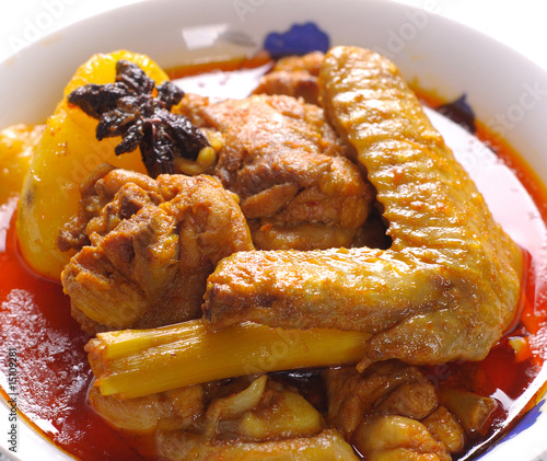 Traditional spicy curry chicken close up